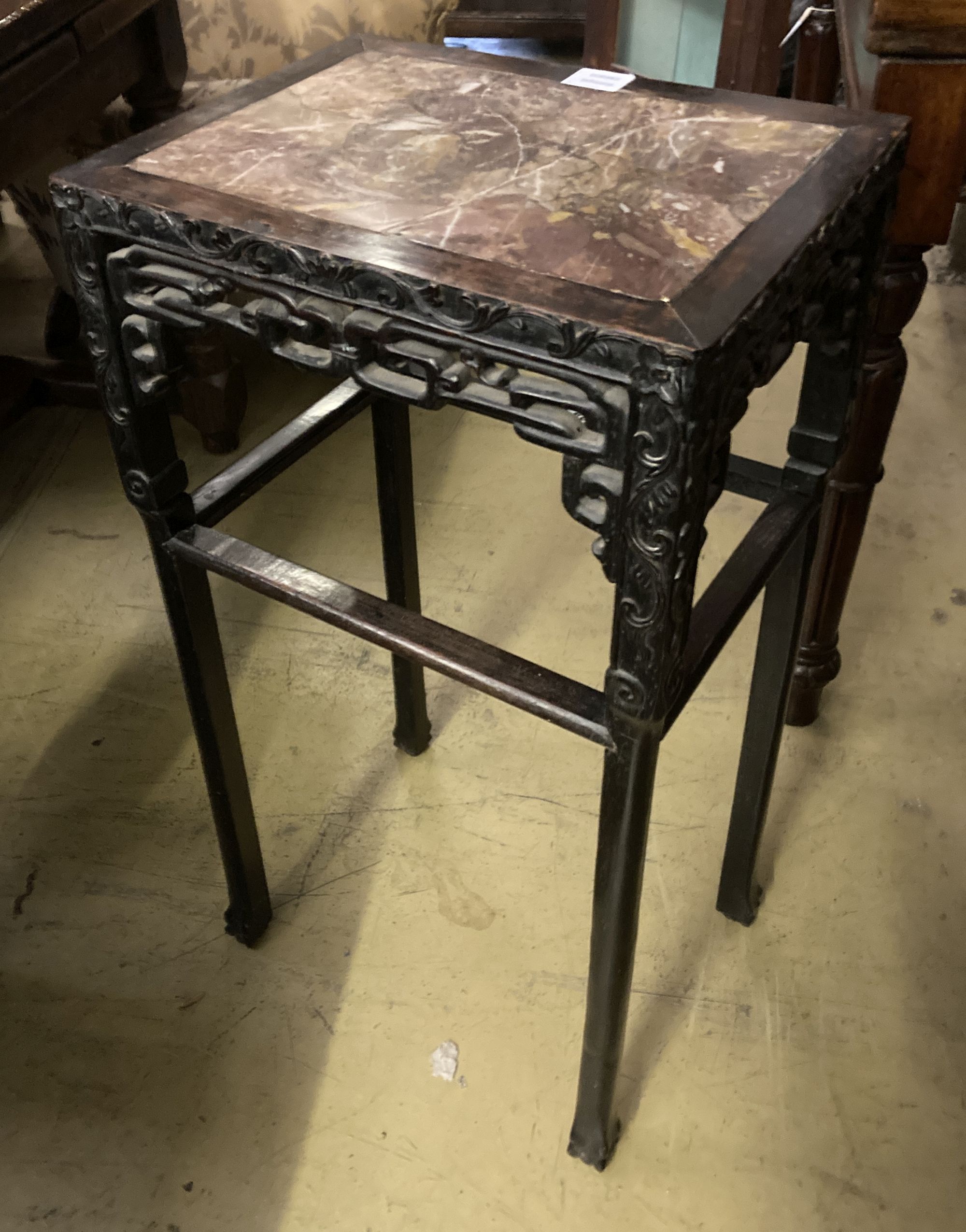 A 19th century Chinese carved hardwood rectangular topped jardiniere stand, with a rouge marble inset top, width 42cm, depth 32cm, heig